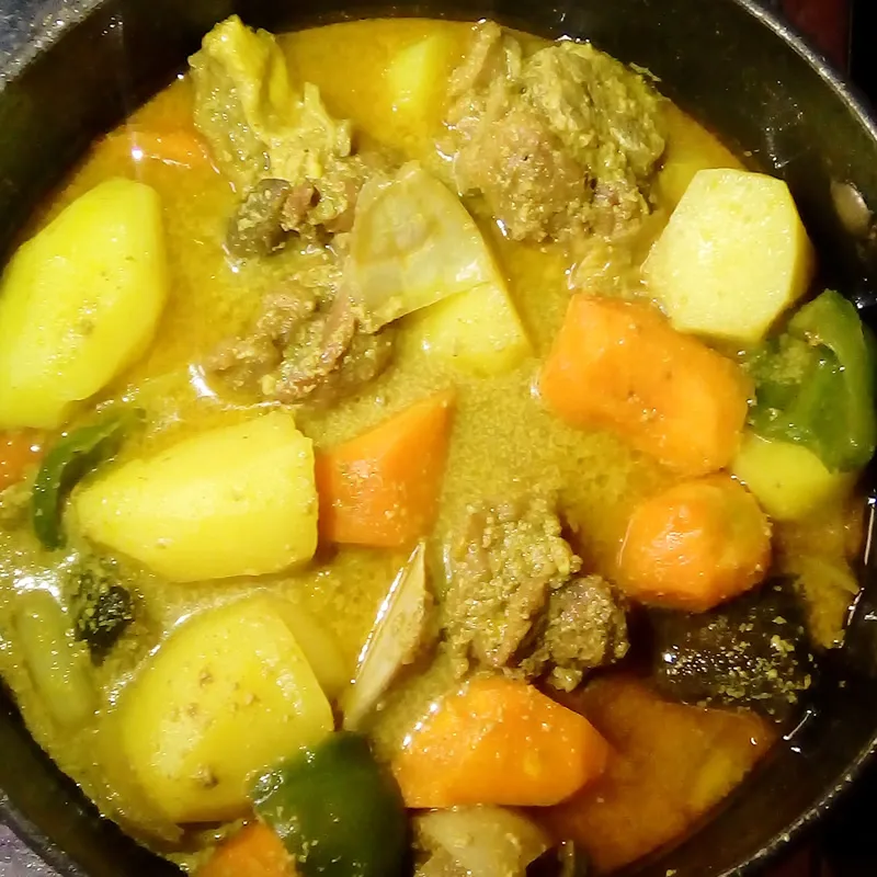Coconut goat curry by Dolapo Grey