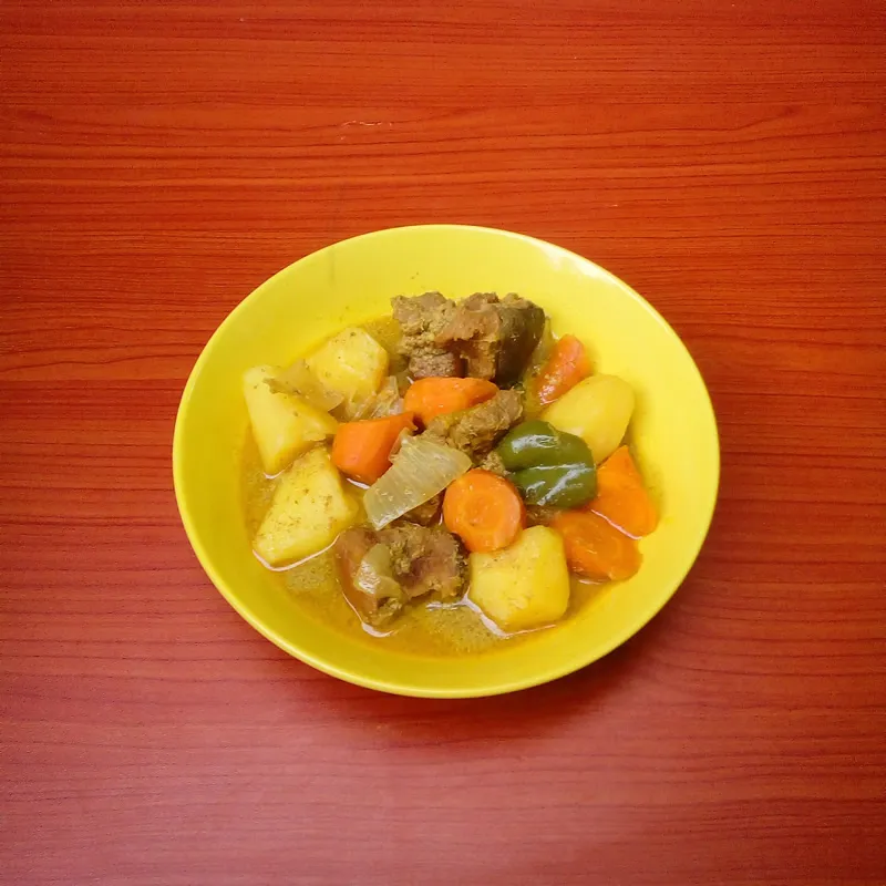 Coconut goat curry by Dolapo Grey