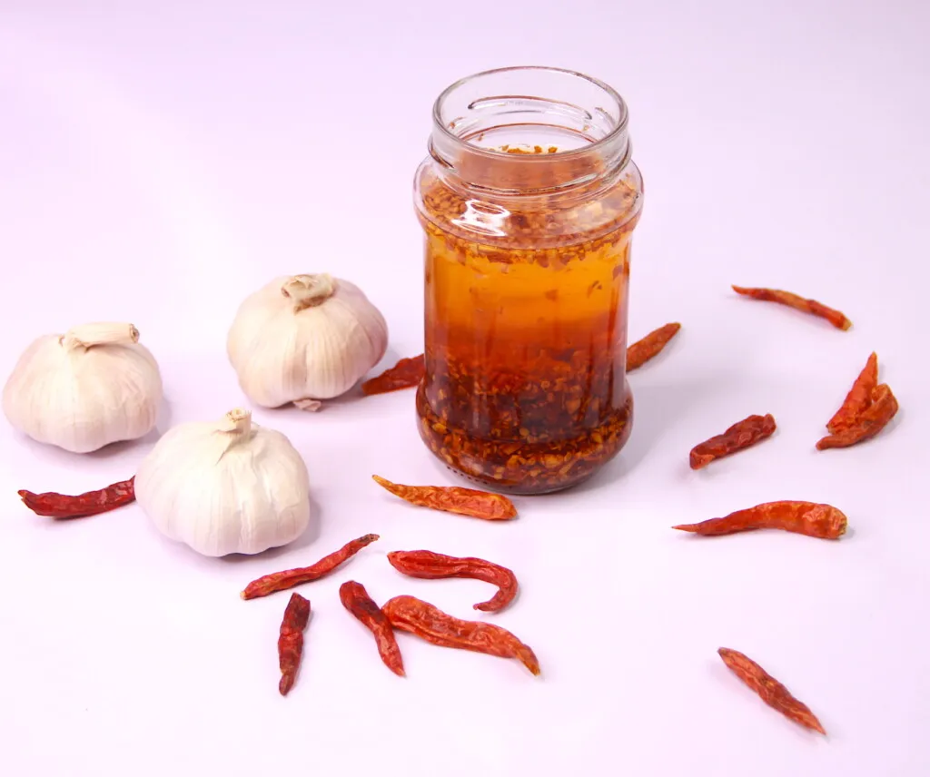 Chili Garlic Oil is a versatile oil. It adds incredible flavour and spice up your dishes. Drizzle it on your noodles, pasta, vegetables, pizza, use it for your stir-fry sauces and It's also perfect as a dip. It's quite easy to make and only takes a few minutes.
